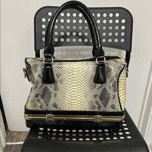 Sophisticated Black and Cream Satchel with Textured Design